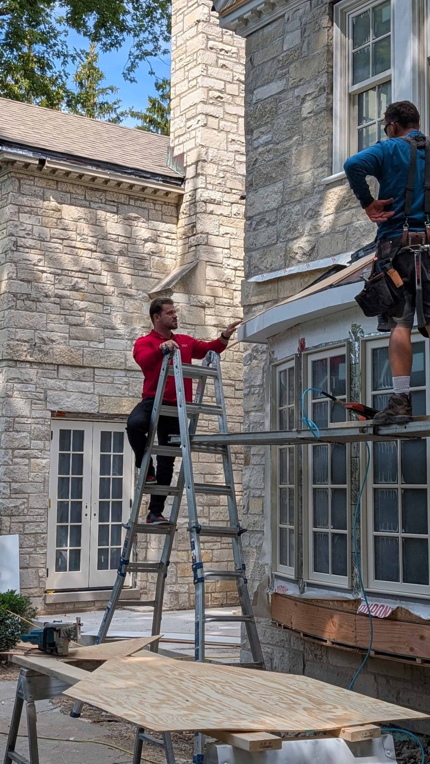 Chicago Roofing specialist on job site instructing worker