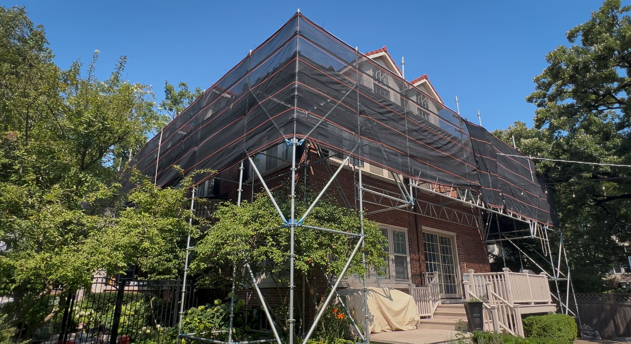 Wolf Development roofing specialists replacing a tile roof using skiff folding in evanston illinois