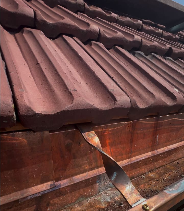 detail view of historic tile roof shingles