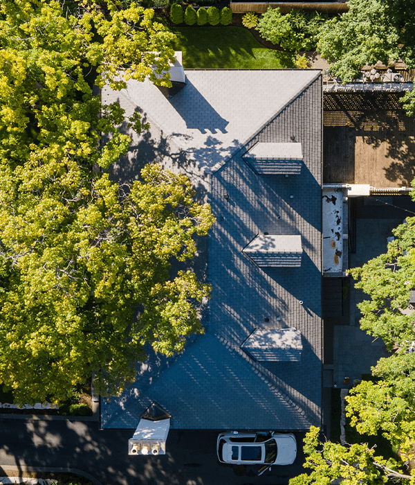 natural slate roof installation on luxury home by Wolf Development roofing company