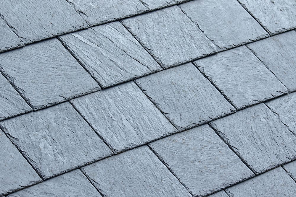 Closeup of clean grey slate roof tiles