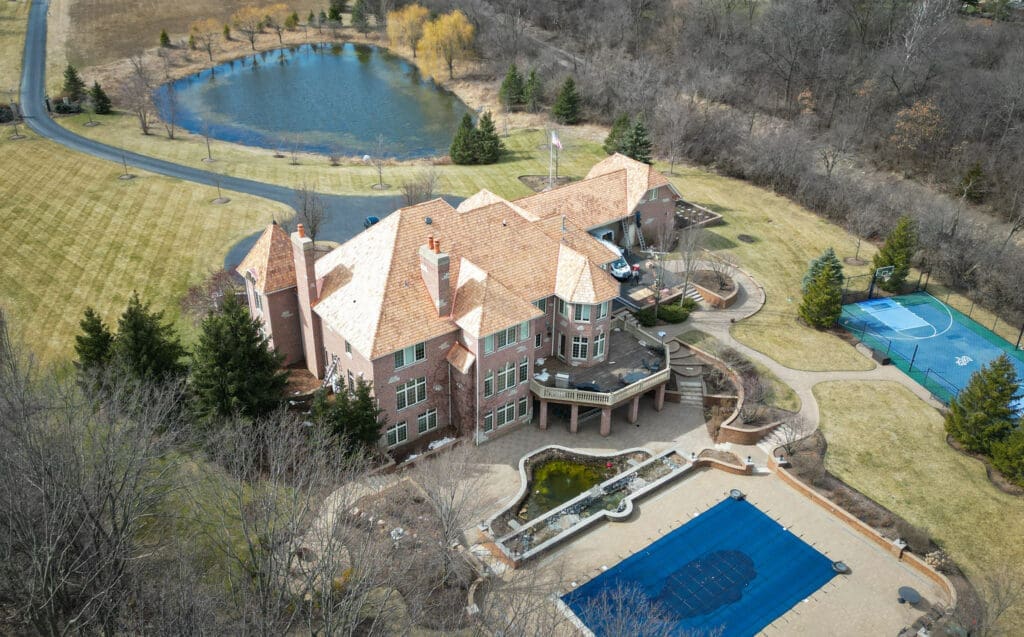 Custom cedar shake roofing installation on a South Barrington estate