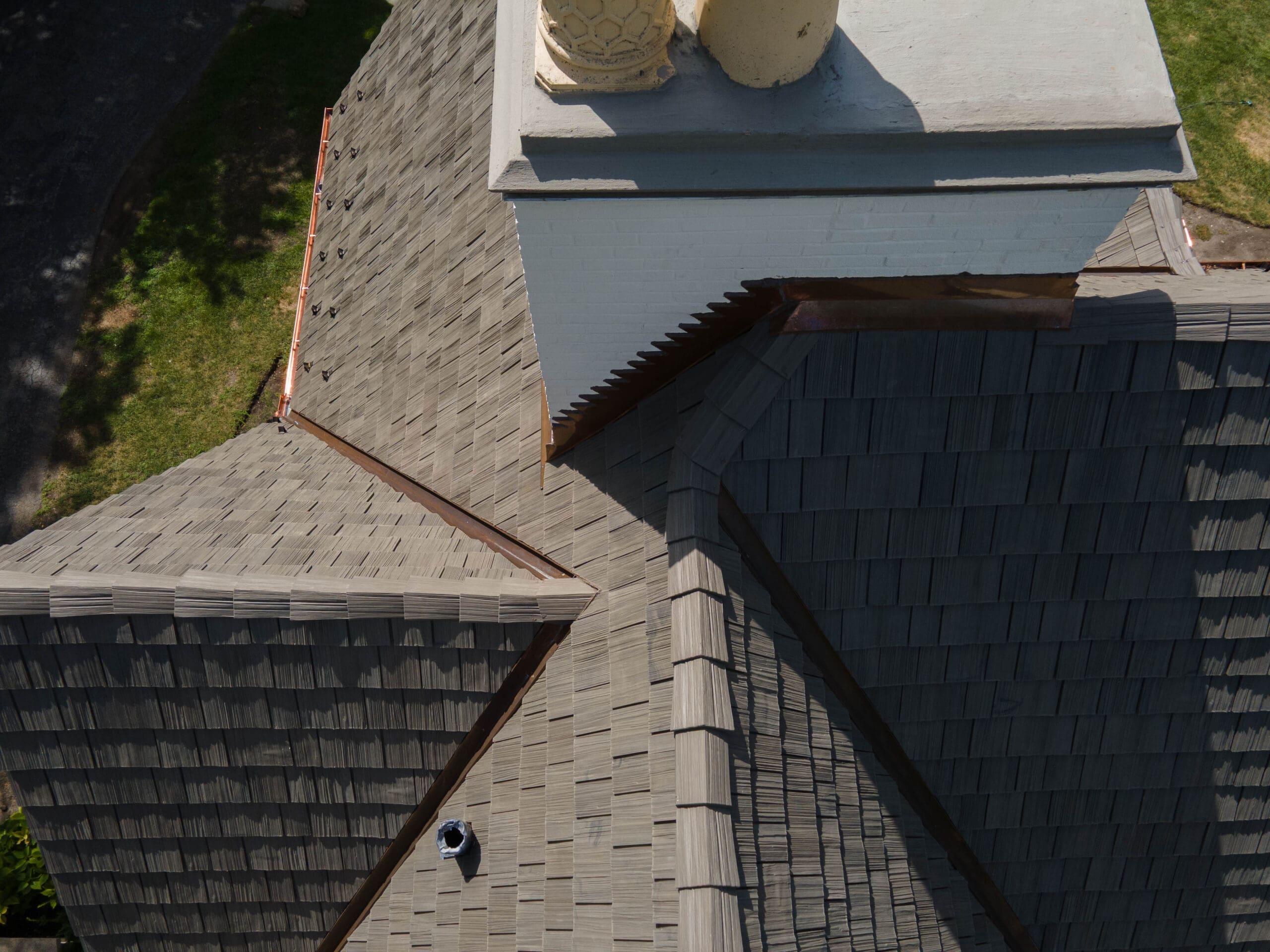 roofing Copper dormer coverings and roof-to-wall transitions on Winnetka Brava synthetic shake roof