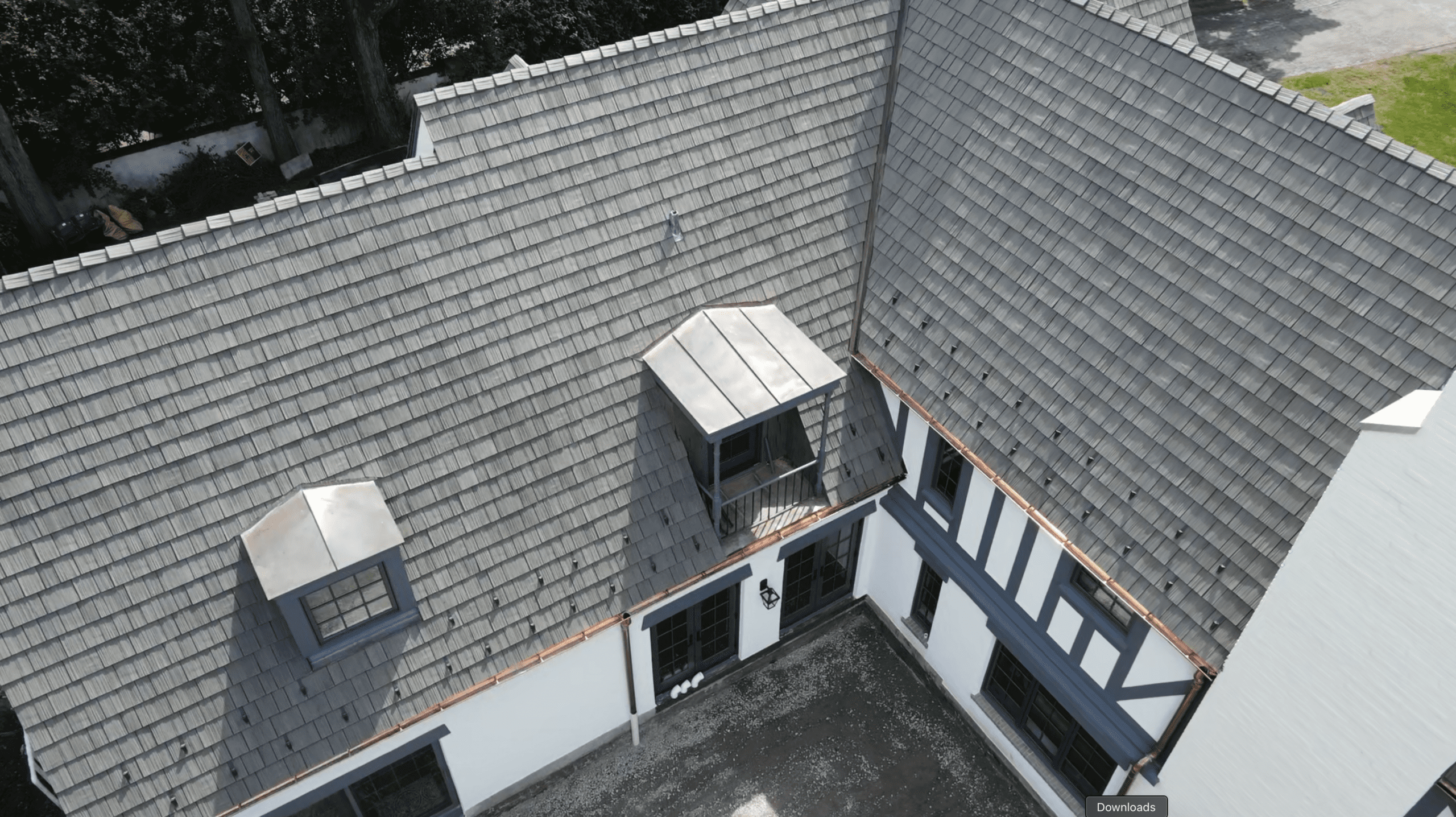 Snow guards installed across roofline on Brava synthetic shake roof in Winnetka