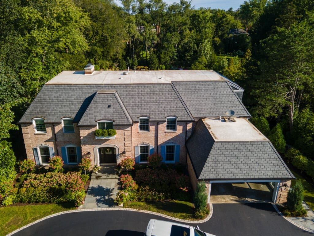 Finished DaVinci slate roof installation and home addition by Wolf Development roofing company