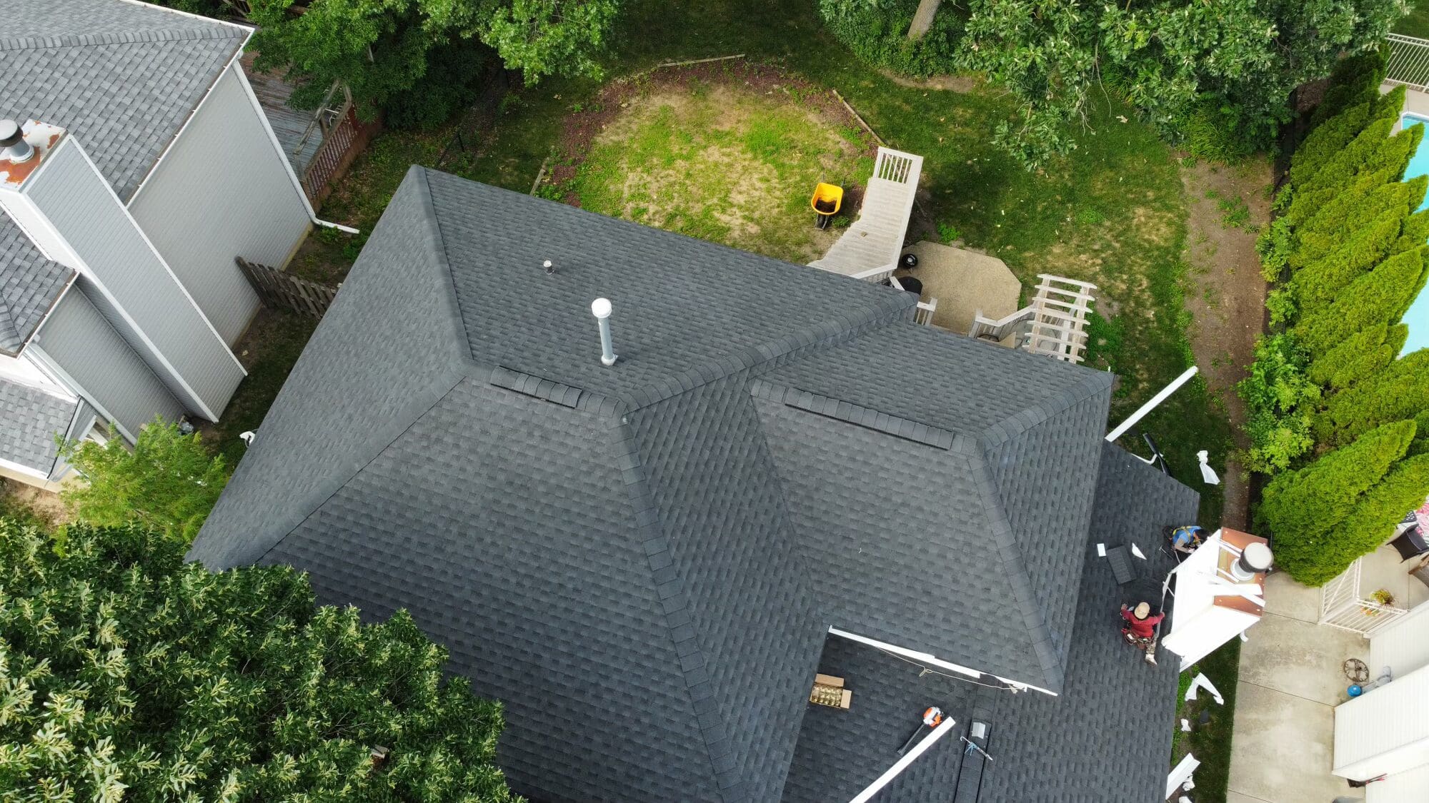Close-up of architectural asphalt shingles showing layered design and texture-Edit