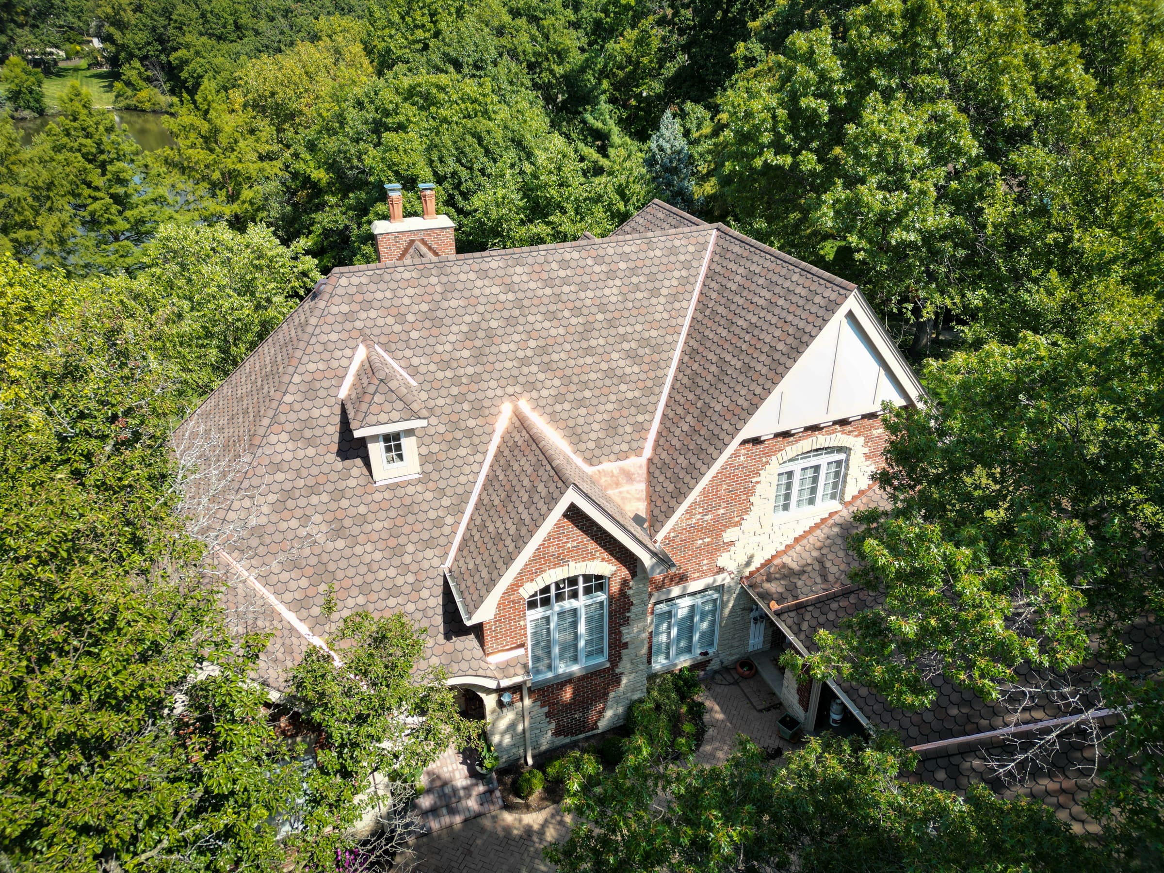 High-end home featuring Grand Manor roofing with custom flashing details-2